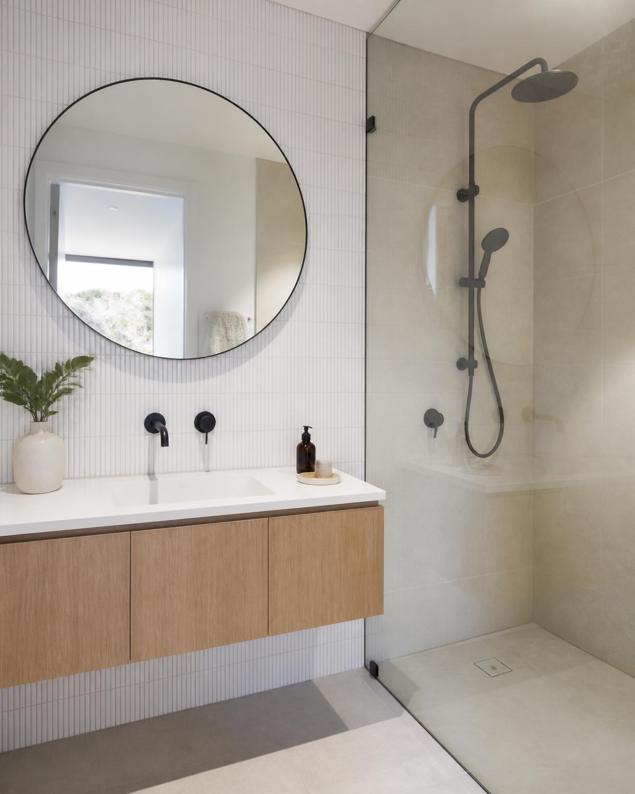 Light Scandinavian bathroom design concept — kit-kat mosaic feature wall, pale timber, matte black fixtures